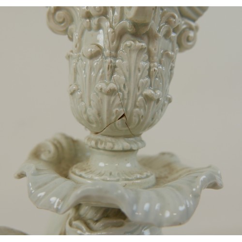 111 - A late 18th century Staffordshire Neale & Co creamware figural candlestick, modelled as a female sph... 