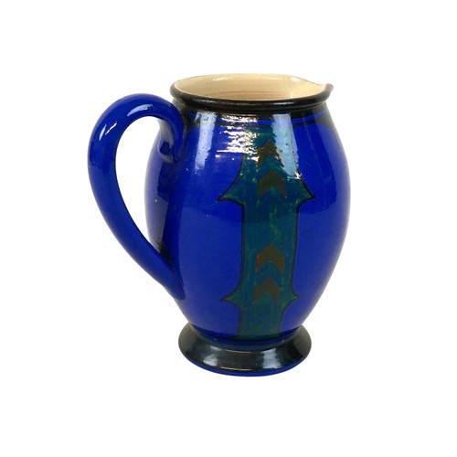 106 - An Arts & Crafts Devon Pottery jug, decorated in a blue and green glaze, 19cm high.