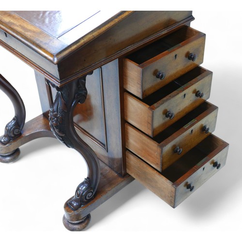 200 - A Victorian mahogany Davenport desk, with a galleried correspondence upstanding and sloping writing ... 