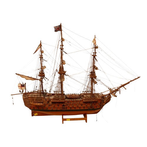 132 - A fully rigged wooden model of HMS VICTORY, 80 by 15 by 60cm high.