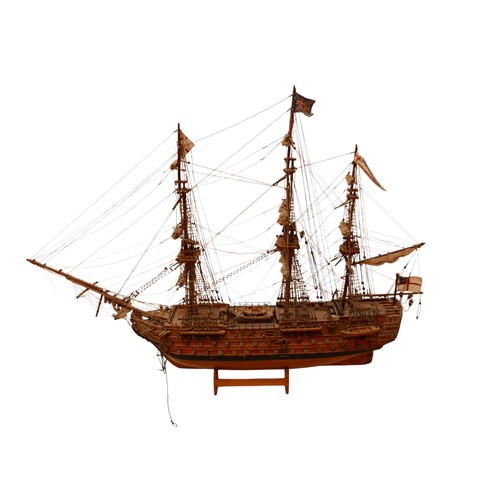 132 - A fully rigged wooden model of HMS VICTORY, 80 by 15 by 60cm high.