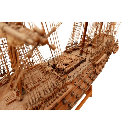 132 - A fully rigged wooden model of HMS VICTORY, 80 by 15 by 60cm high.