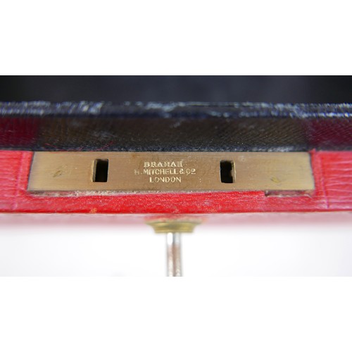 151 - An Elizabeth II red Morocco leather British government dispatch box with gilt embossed ERII cipher t... 