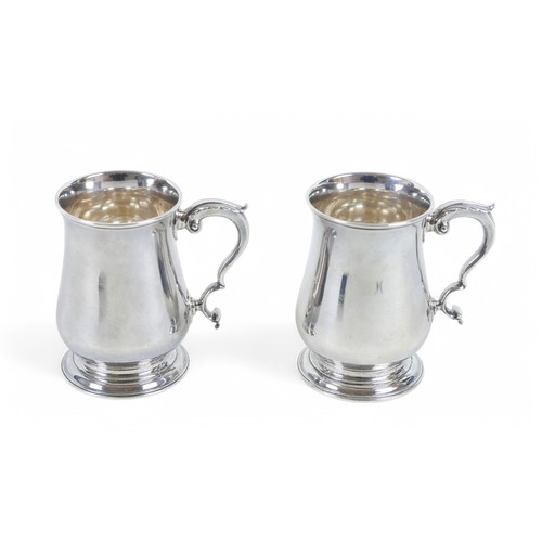 35 - A pair of George III silver tankards, Francis Crump, London 1770/71, 12 by 8 by 11.5cm high, weight ... 