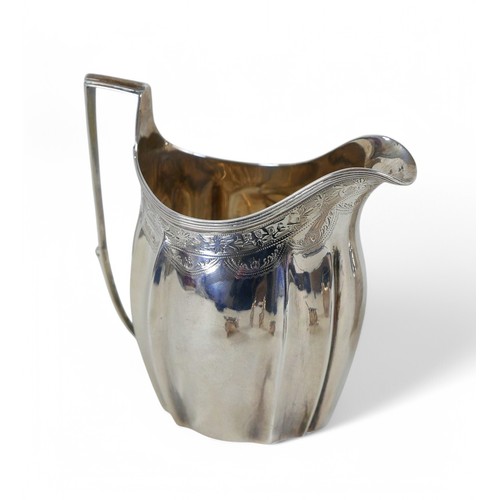 27 - A collection of George III and later silver, comprising a George III silver milk jug, 12cm high, a D... 