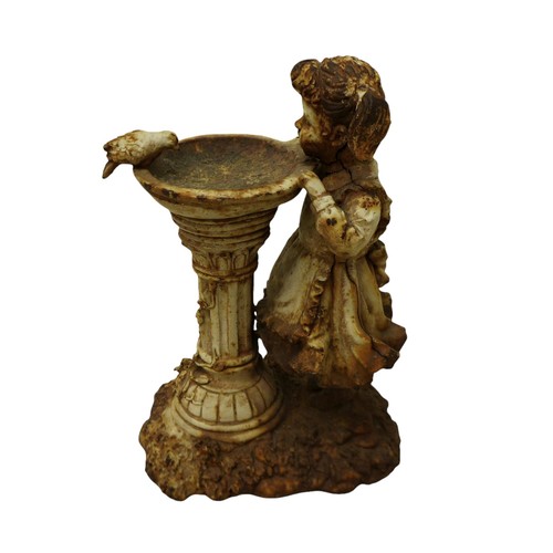 164 - A cast iron figure of a girl by a birdbath, 19 by 11 by 29cm high.