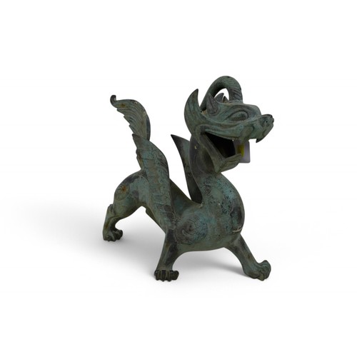 126 - A bronze dragon with green patinated finish, 38 by 12 by 36cm high.