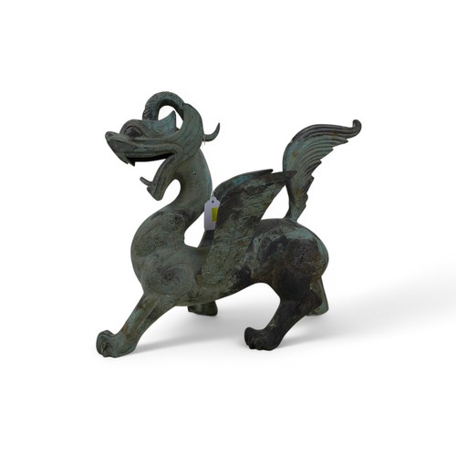 126 - A bronze dragon with green patinated finish, 38 by 12 by 36cm high.