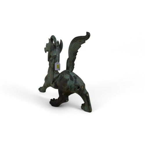 126 - A bronze dragon with green patinated finish, 38 by 12 by 36cm high.