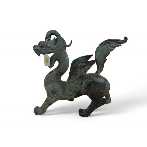 126 - A bronze dragon with green patinated finish, 38 by 12 by 36cm high.