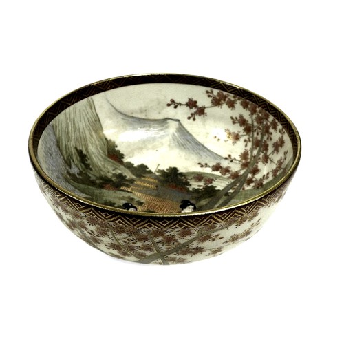 127 - A late 19th century satsuma bowl, decorated with figures with Mount Fuji in the distance, in a prese... 