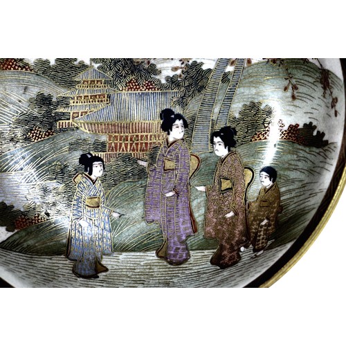 127 - A late 19th century satsuma bowl, decorated with figures with Mount Fuji in the distance, in a prese... 