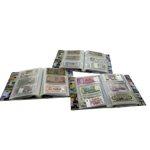 117 - Three large folders of world banknotes.(3 )