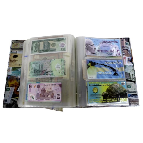 117 - Three large folders of world banknotes.(3 )