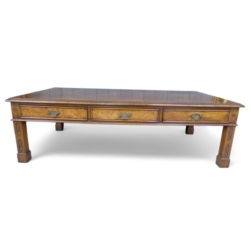 296 - A burr walnut coffee table, with three active and three opposing dummy drawers on square section leg... 