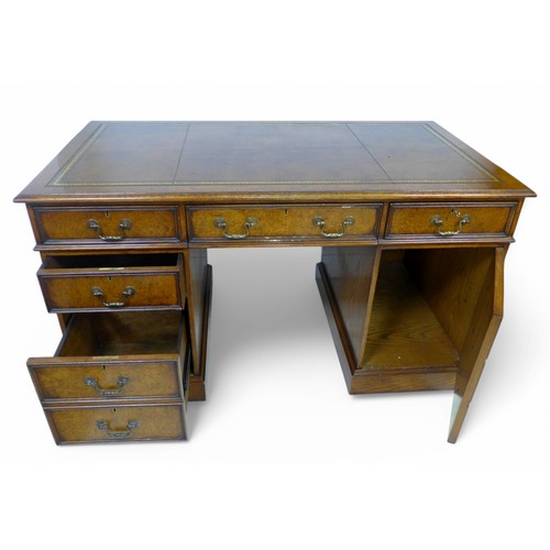 318 - A Victorian style walnut twin pedestal desk, with a leather inset top above three frieze drawers, tw... 