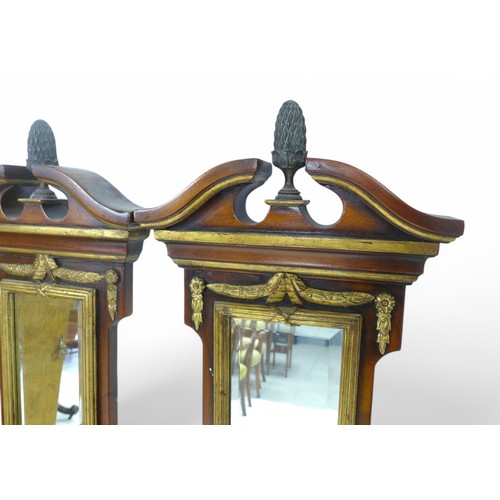 239 - A pair of Regency style mahogany and gilt wall mirrors, each having three statuette shelves, 40 by 1... 