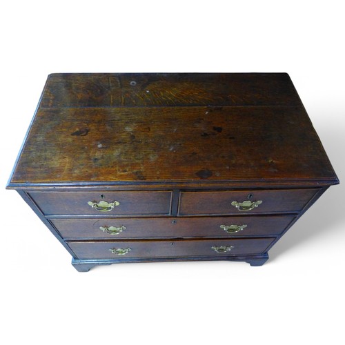 310 - A George III oak four drawer chest on shaped bracket feet, 89 by 49 by 74cm high.