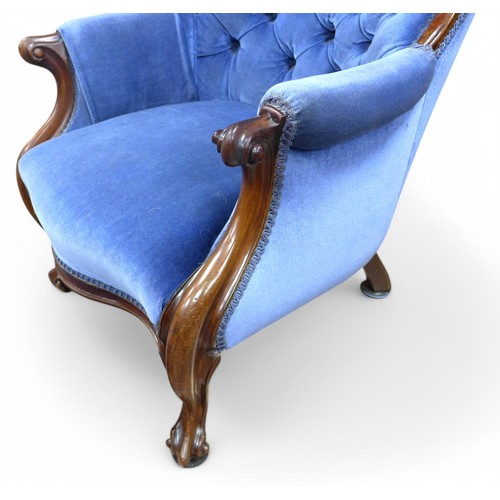 314 - A Victorian mahogany button back armchair and a stool, chair measures 85 by 76 by 91cm high. (2)