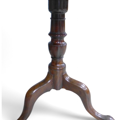 307 - A George III mahogany tripod side table, with a single piece    85cm top on a turned baluster column... 