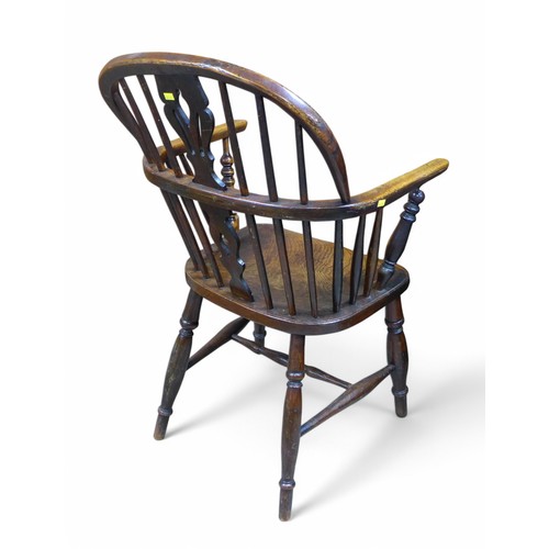 315 - A 19th century ash and elm Windsor chair, with a shaped splat an turned supports, 54 by 49 by 91cm h... 