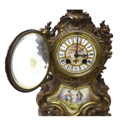 215 - A French 19th century gilt brass mantel clock, the case with inset painted porcelain plaques, 8-day ... 