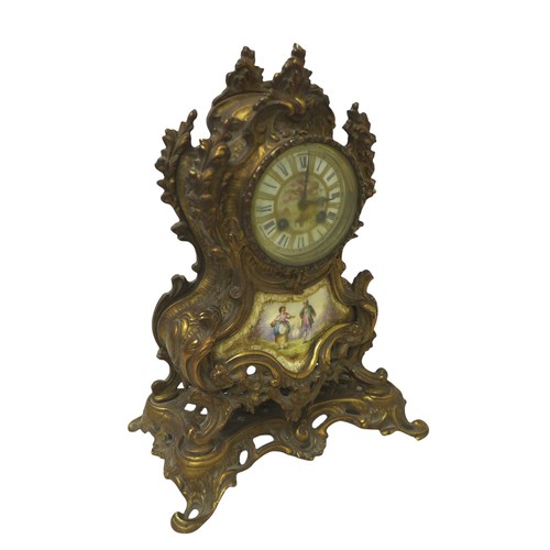 215 - A French 19th century gilt brass mantel clock, the case with inset painted porcelain plaques, 8-day ... 