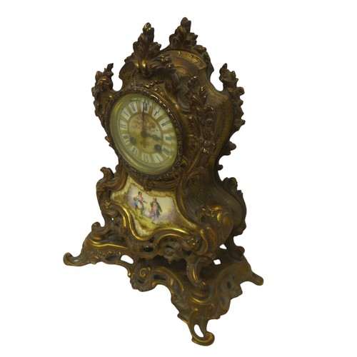 215 - A French 19th century gilt brass mantel clock, the case with inset painted porcelain plaques, 8-day ... 