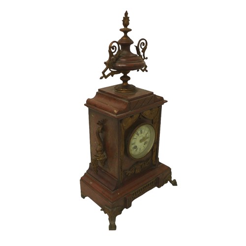 216 - A French 19th century mantel clock, the red marble case decorated with floral swags and surmounted b... 