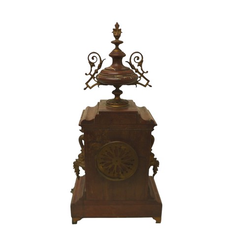 216 - A French 19th century mantel clock, the red marble case decorated with floral swags and surmounted b... 