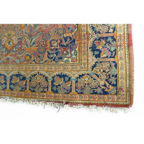 332 - A pair of hand knotted woolen Kashan Persian rugs, with a central medallion on a red field and styli... 