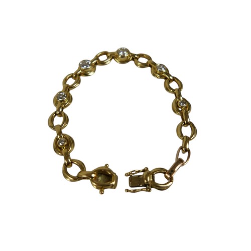 110 - An 18ct yellow gold diamond bracelet, the chain link bracelet set with six diamonds graduating in si... 