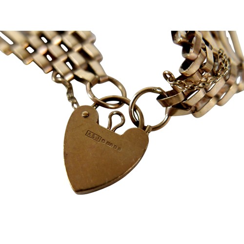 45 - A 9ct yellow gold gate link bracelet, with heart shaped padlock clasp and attached safety chain, 20m... 