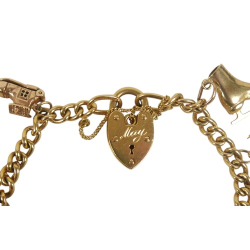 53 - A 9ct yellow gold kerb link charm bracelet, fitted with twelve 9ct gold / unmarked charms, including... 