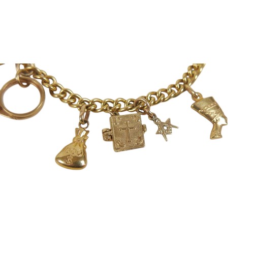 53 - A 9ct yellow gold kerb link charm bracelet, fitted with twelve 9ct gold / unmarked charms, including... 