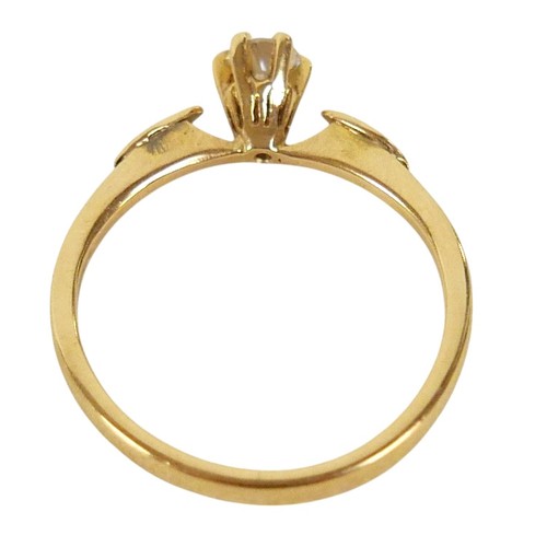 87 - An 18ct yellow gold and diamond solitaire ring, the round cut stone, 3.5 by 2.5mm, 0.17ct, in six cl... 