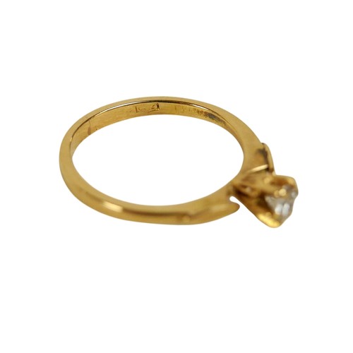 87 - An 18ct yellow gold and diamond solitaire ring, the round cut stone, 3.5 by 2.5mm, 0.17ct, in six cl... 