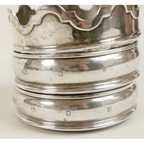 9 - A pair of Elizabeth II silver wine bottle coasters, with plain rims and sides, with turned wooden an... 