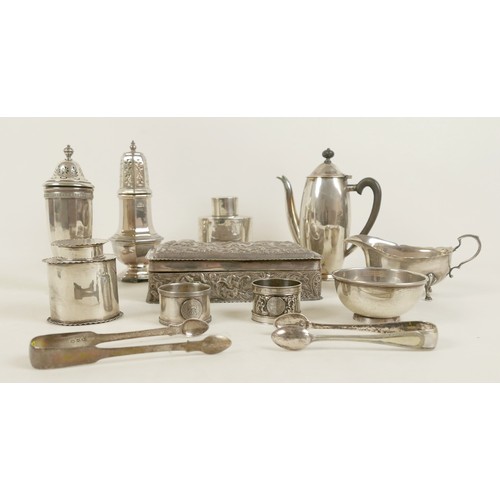 34 - A collection of silver items, comprising small George V silver coffee pot, 16.5cm high, two sugar ca... 