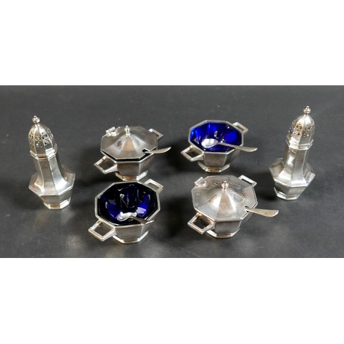 22 - An Elizabeth II silver six piece cruet set, in Art Deco style with octagonal section design, compris... 