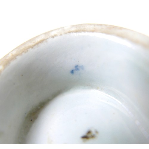 137 - An 18th century Lowestoft porcelain small sauce boat, decorated with moulded exterior and in undergl... 