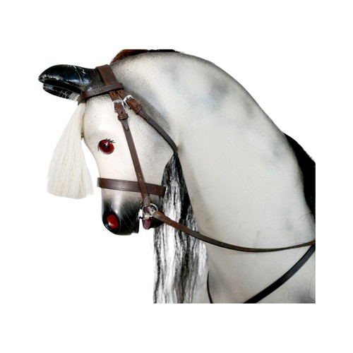 226 - A piebald wooden rocking horse by Horseplay with leather saddle and tack, 127 by 45 by 120cm high.