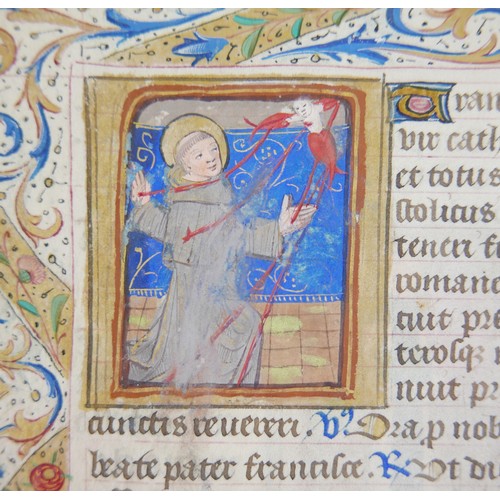 302 - A late 15th century French illuminated manuscript vellum leaf, with quarter page miniatures of St Fi... 