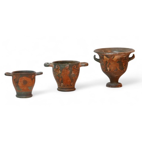 268 - Three Attic style red figure terracotta vases, comprising a bell krater vase, 22 by 19.5cm high over... 