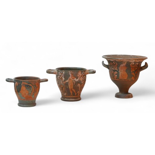 268 - Three Attic style red figure terracotta vases, comprising a bell krater vase, 22 by 19.5cm high over... 