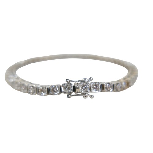 10 - An 18ct white gold diamond tennis bracelet, forty-five round cuts diamonds, each stone approximately... 