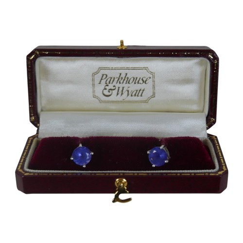 11 - A pair of 18ct white gold tanzanite earrings, each stone approximately 7mm diameter, 3.6g overall, w... 