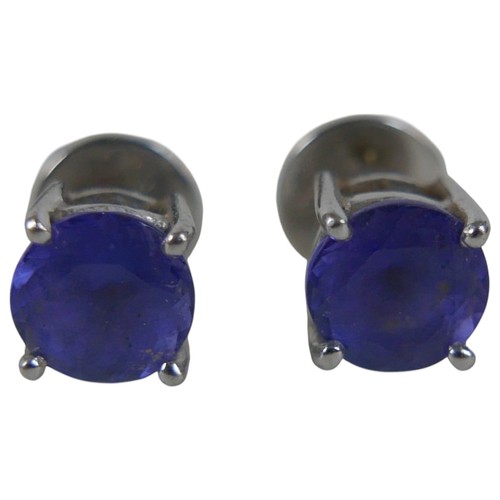 11 - A pair of 18ct white gold tanzanite earrings, each stone approximately 7mm diameter, 3.6g overall, w... 