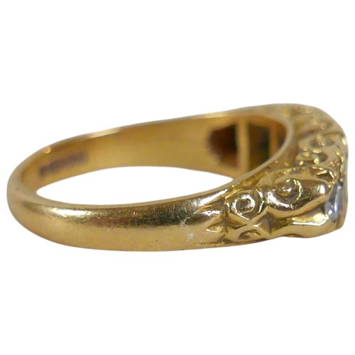 5 - An 18ct yellow gold five stone emerald and diamond ring the central diamond approximately 0.25ct, ri... 