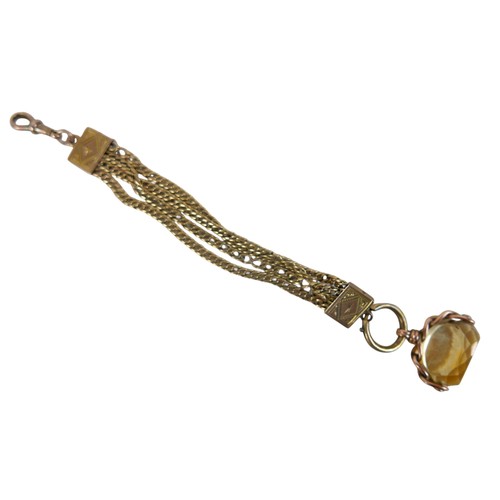 44 - A yellow metal fob chain, fitted with a yellow quartz  swivel fob, multi strand chain with engraved ... 